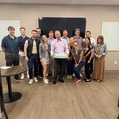 The Gallagher team gathered in their office