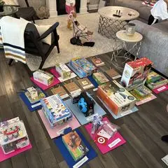 Birthday gifts laid out on a living-room floor